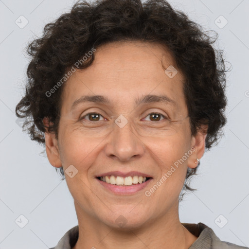 Joyful white adult female with short  brown hair and brown eyes