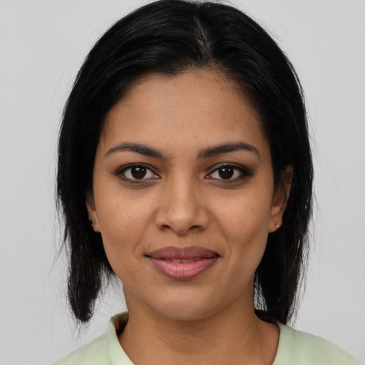 Joyful asian young-adult female with medium  black hair and brown eyes