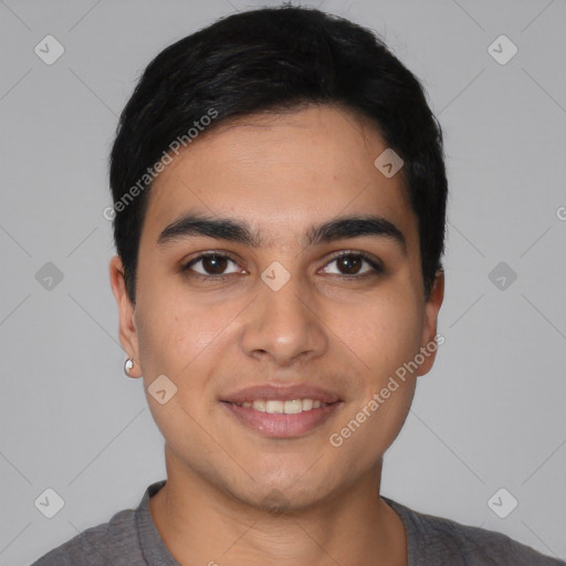 Joyful latino young-adult male with short  black hair and brown eyes