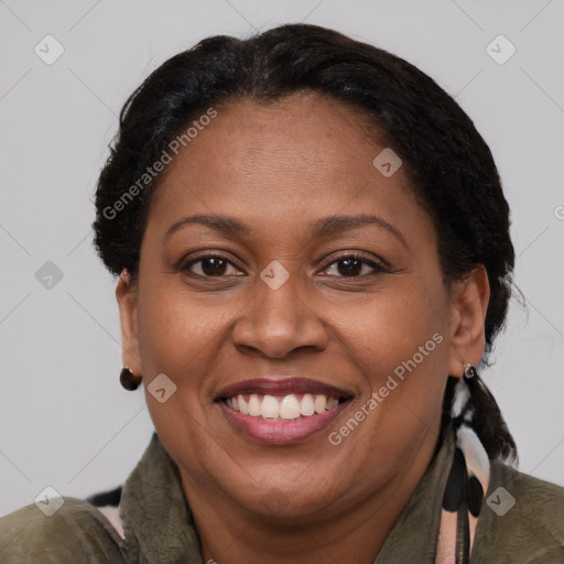 Joyful latino adult female with short  brown hair and brown eyes