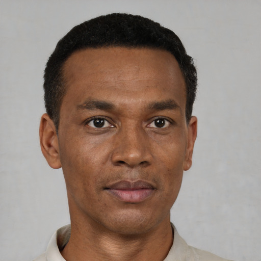 Neutral black adult male with short  black hair and brown eyes