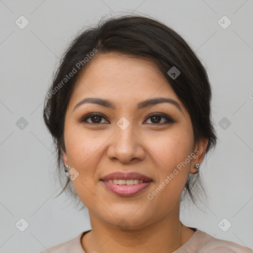 Joyful latino young-adult female with medium  brown hair and brown eyes