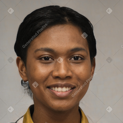 Joyful black young-adult female with short  black hair and brown eyes