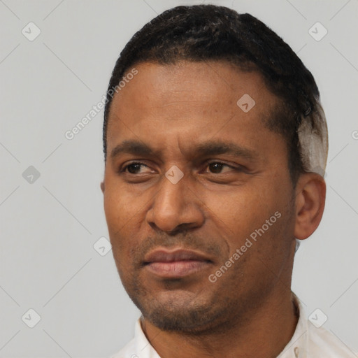 Neutral latino adult male with short  black hair and brown eyes