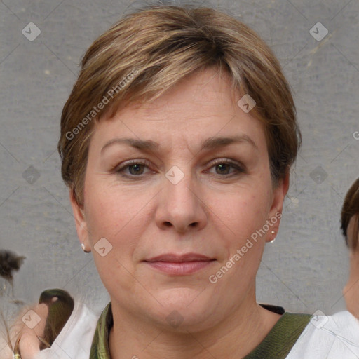 Joyful white adult female with short  brown hair and brown eyes