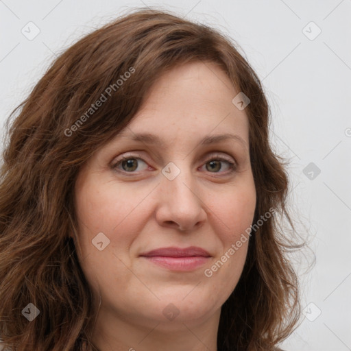 Joyful white young-adult female with long  brown hair and green eyes