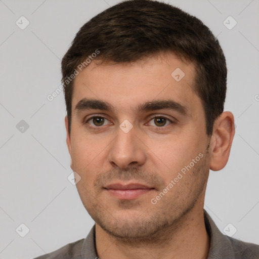 Neutral white young-adult male with short  brown hair and brown eyes