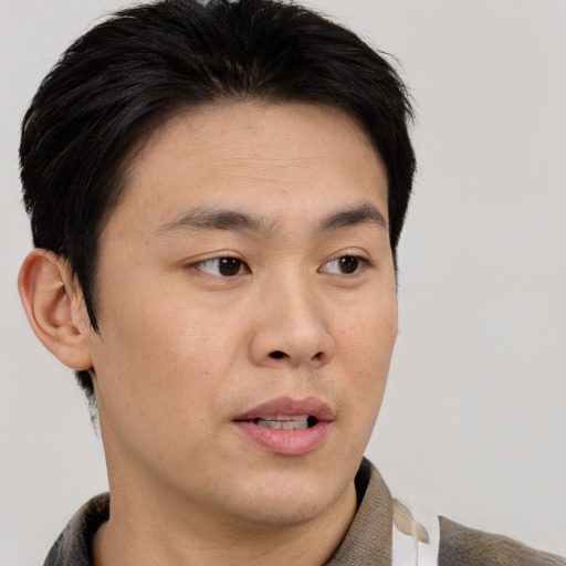 Neutral asian young-adult male with short  brown hair and brown eyes