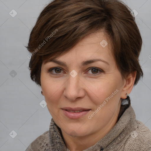 Joyful white adult female with medium  brown hair and brown eyes