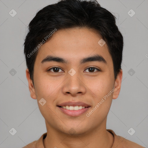 Joyful asian young-adult male with short  brown hair and brown eyes