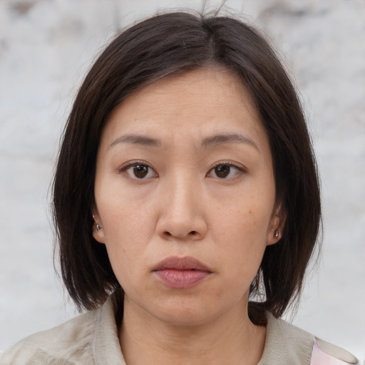 Neutral white young-adult female with medium  brown hair and brown eyes