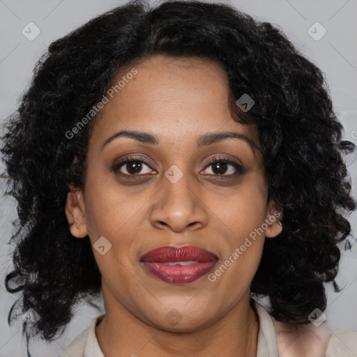 Joyful black adult female with medium  brown hair and brown eyes