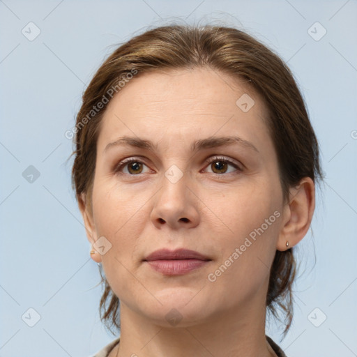 Joyful white adult female with medium  brown hair and brown eyes