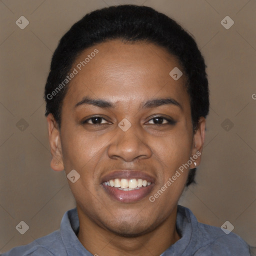 Joyful black young-adult female with short  black hair and brown eyes