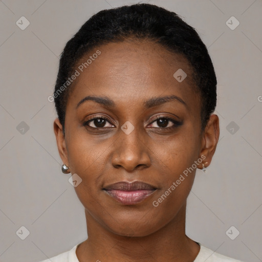 Joyful black young-adult female with short  black hair and brown eyes