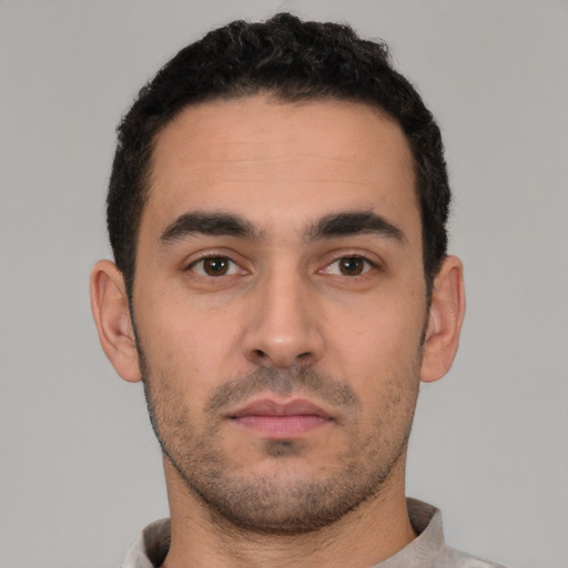 Neutral white young-adult male with short  black hair and brown eyes