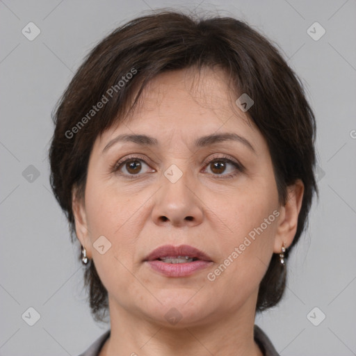 Joyful white adult female with medium  brown hair and brown eyes