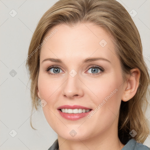 Joyful white young-adult female with medium  brown hair and blue eyes