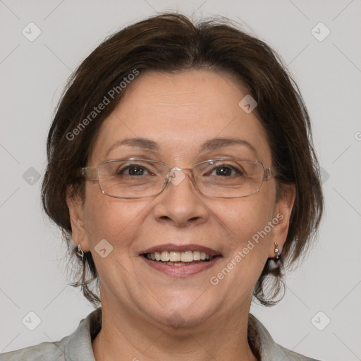 Joyful white adult female with medium  brown hair and grey eyes