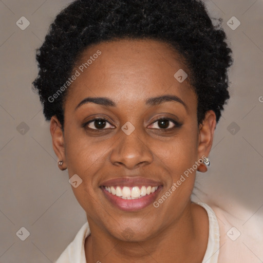 Joyful black young-adult female with short  brown hair and brown eyes