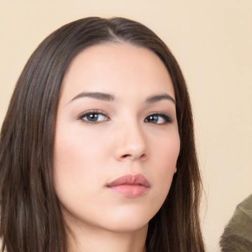 Neutral white young-adult female with long  brown hair and brown eyes