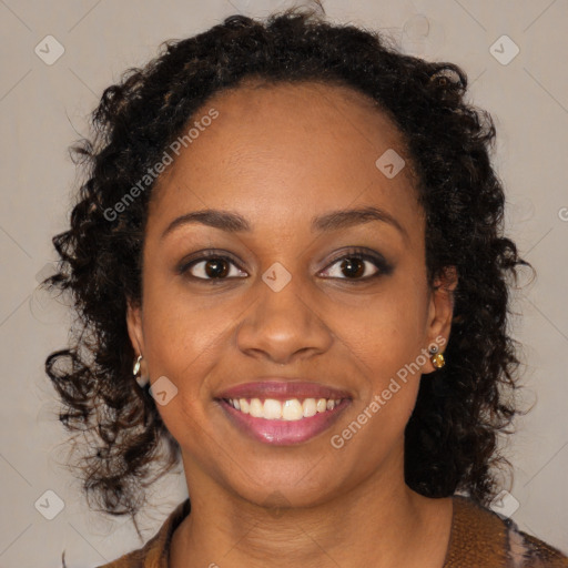 Joyful black young-adult female with long  brown hair and brown eyes