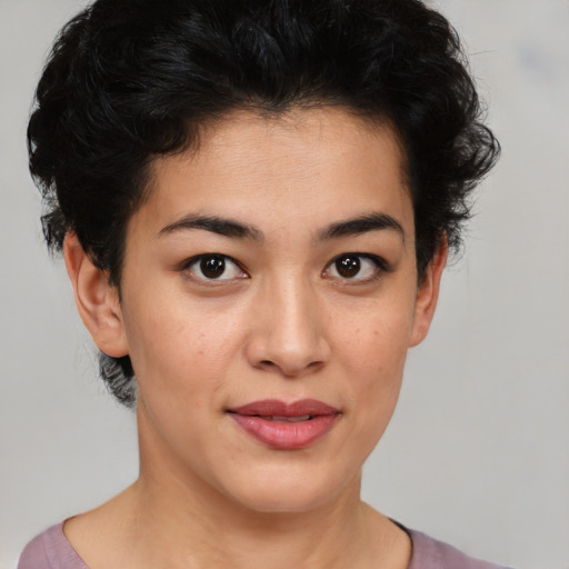 Joyful asian young-adult female with short  brown hair and brown eyes