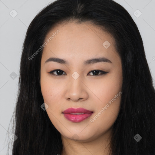 Joyful asian young-adult female with long  black hair and brown eyes