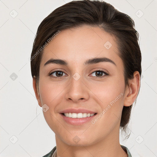 Joyful white young-adult female with short  brown hair and brown eyes