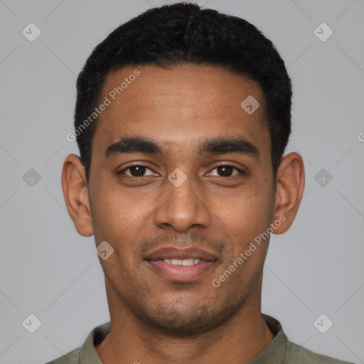 Joyful black young-adult male with short  black hair and brown eyes