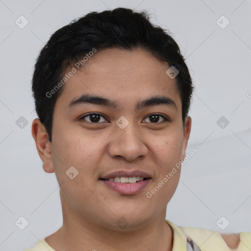 Joyful latino young-adult male with short  brown hair and brown eyes