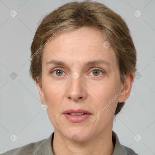 Joyful white adult female with short  brown hair and grey eyes