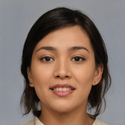 Joyful asian young-adult female with medium  brown hair and brown eyes