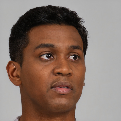 Neutral black young-adult male with short  brown hair and brown eyes
