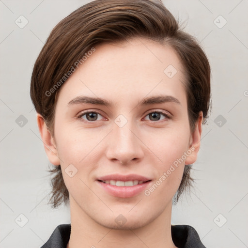 Joyful white young-adult female with short  brown hair and grey eyes