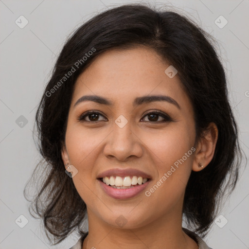 Joyful latino young-adult female with medium  brown hair and brown eyes