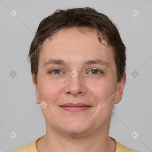 Joyful white adult female with short  brown hair and grey eyes