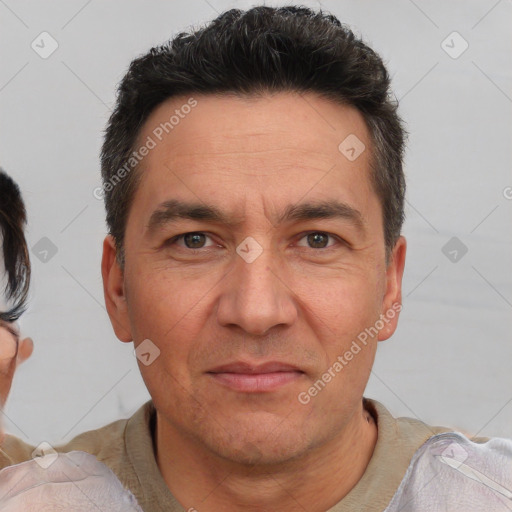 Joyful white adult male with short  brown hair and brown eyes