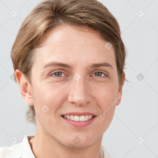 Joyful white young-adult female with short  brown hair and grey eyes