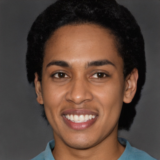 Joyful latino young-adult female with short  black hair and brown eyes