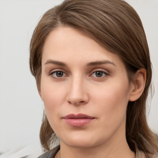 Neutral white young-adult female with long  brown hair and grey eyes