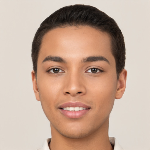 Joyful latino young-adult male with short  black hair and brown eyes