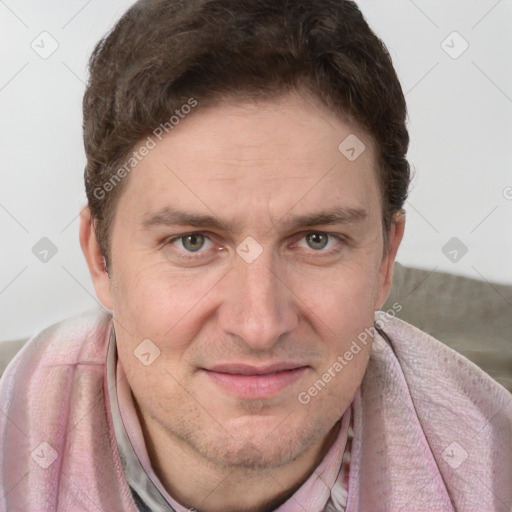 Joyful white adult male with short  brown hair and grey eyes