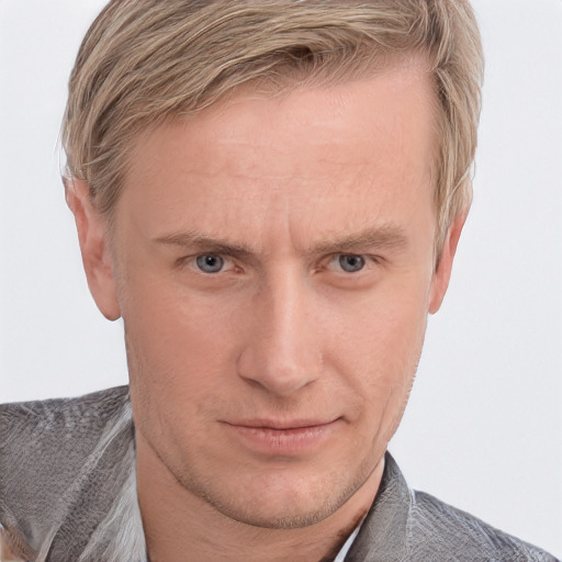 Joyful white adult male with short  brown hair and grey eyes