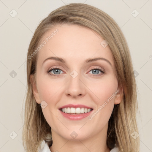 Joyful white young-adult female with medium  brown hair and green eyes