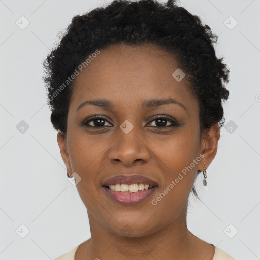 Joyful black young-adult female with short  brown hair and brown eyes