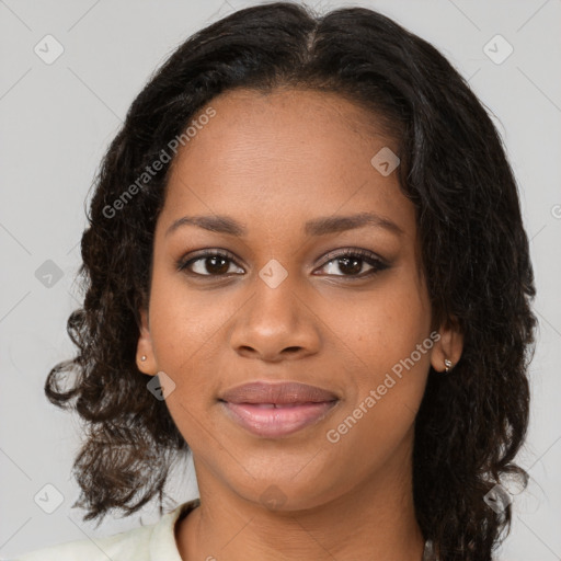 Joyful black young-adult female with medium  brown hair and brown eyes