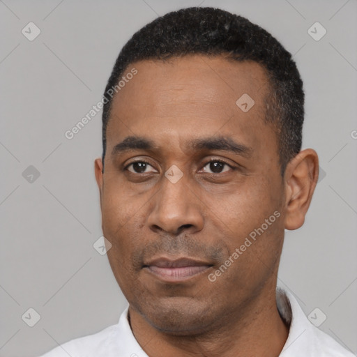 Joyful latino adult male with short  black hair and brown eyes