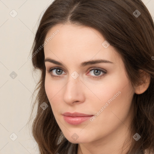 Neutral white young-adult female with long  brown hair and brown eyes