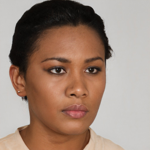 Neutral latino young-adult female with short  black hair and brown eyes